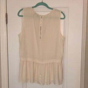 Jcrew off white sleeveless flounce top.